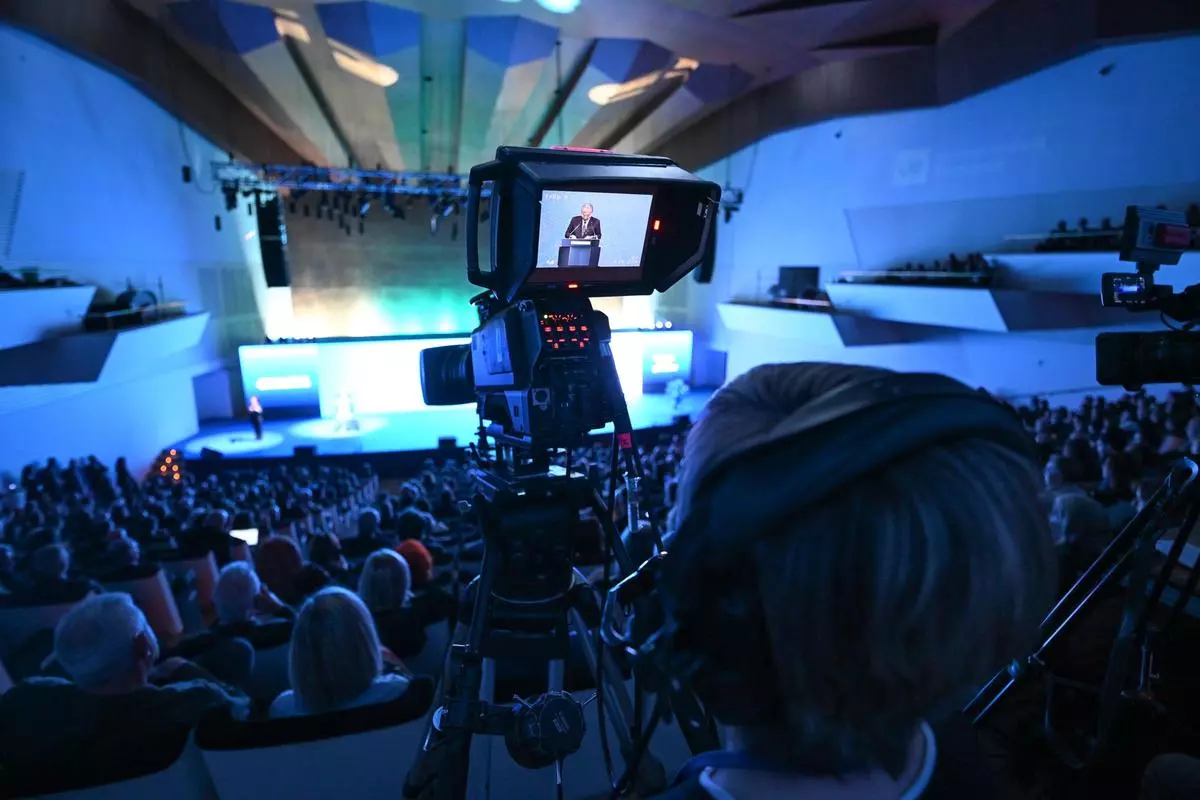 Camera viewfinder capturing a keynote speaker